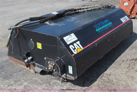 caterpillar skid steer bucket|cat skid steer sweeper attachment.